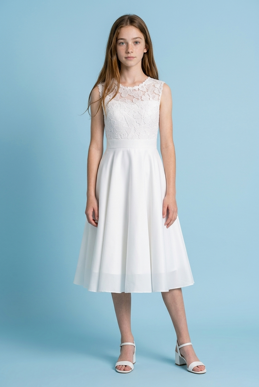 Girl wearing a white chiffon communion dress