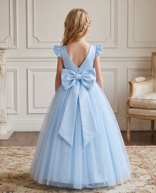 Back view of blue communion dress with oversized satin bow and V-back