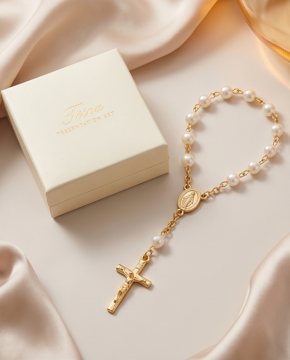 Gold-tone pearl rosary bracelet with white gift packaging