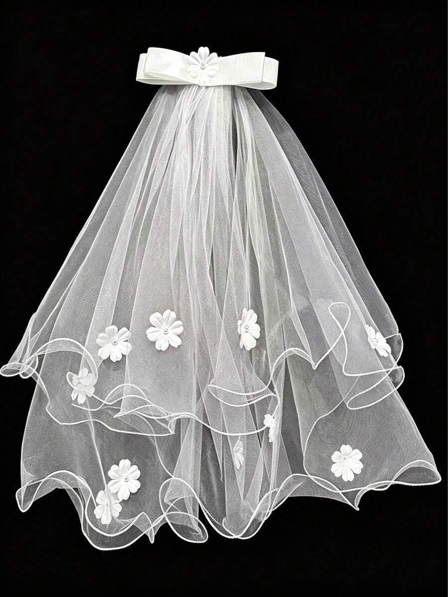White wedding veil with floral embroidery on a black background