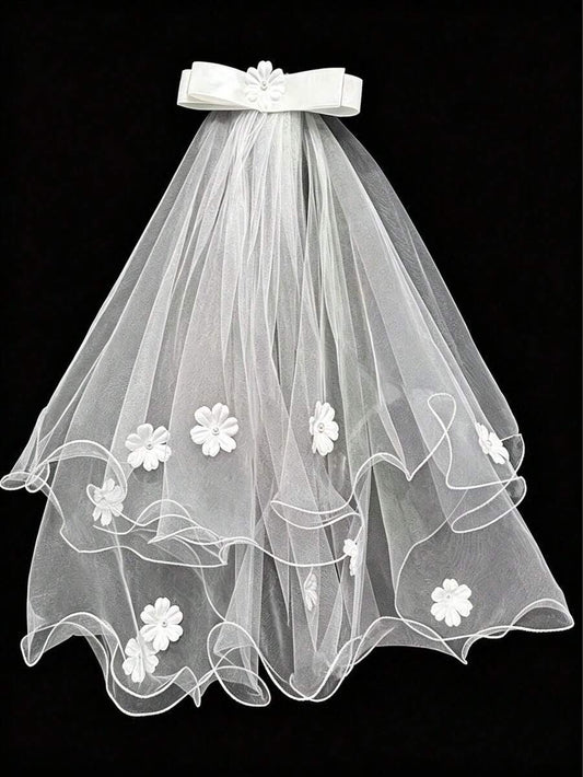 White wedding veil with floral embroidery on a black background