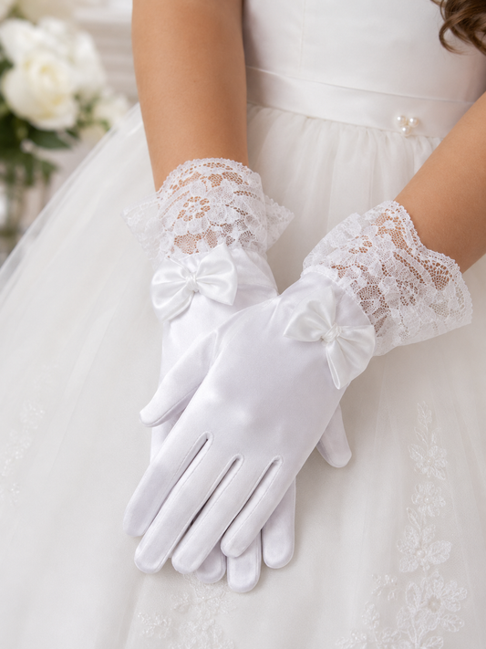 White lace gloves worn with a white dress, blurred floral background