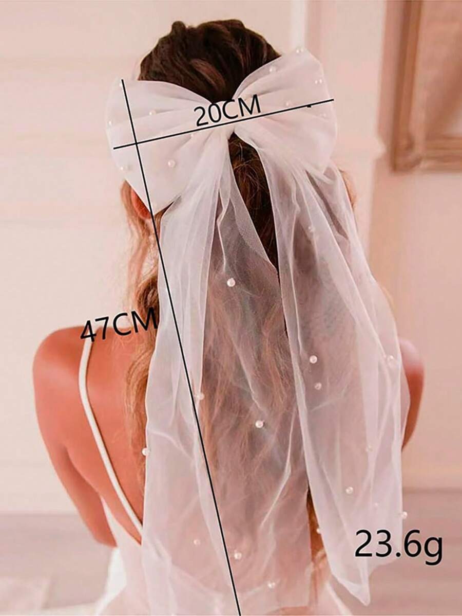 White veil with measurements and weight details on a plain background