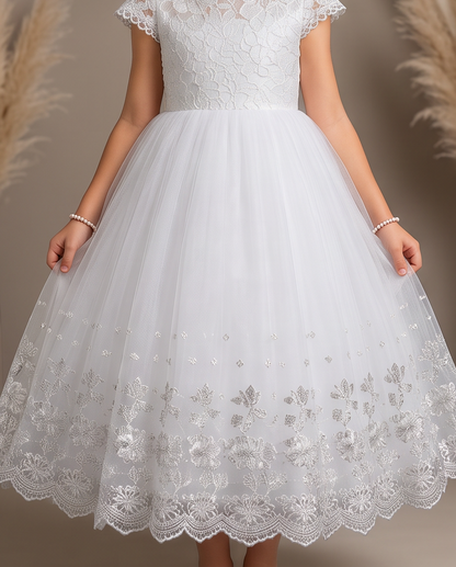 Child wearing a white communion dress