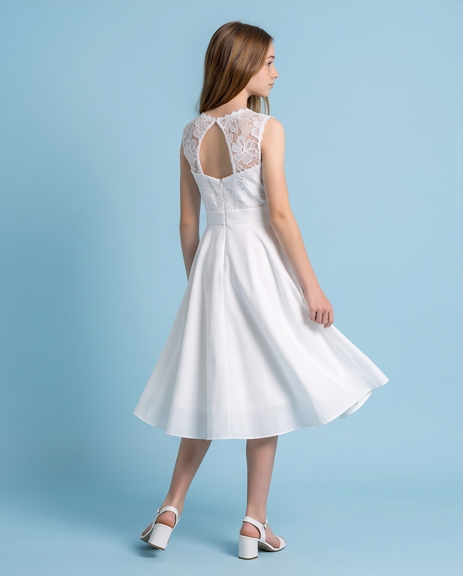 Girl wearing a white chiffon communion dress