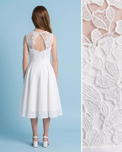Girl wearing a white chiffon communion dress