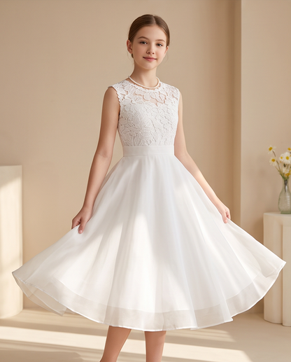 Girl wearing a white chiffon communion dress