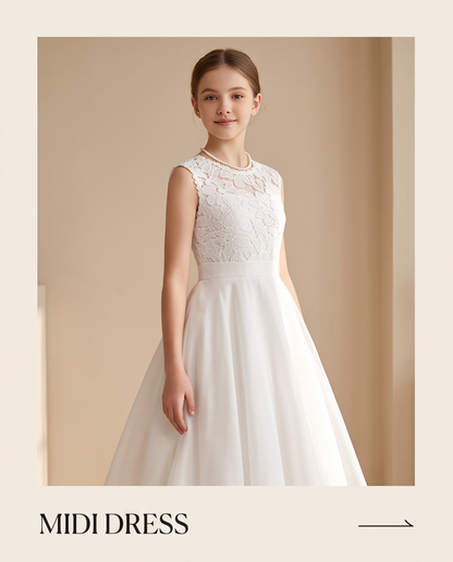 Girl wearing a white chiffon communion dress