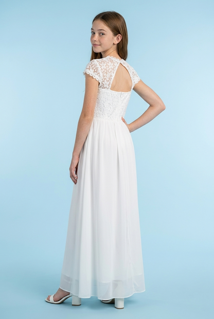 A young girl modeling a white lace and chiffon maxi dress, shown from the back against a solid light blue studio background.