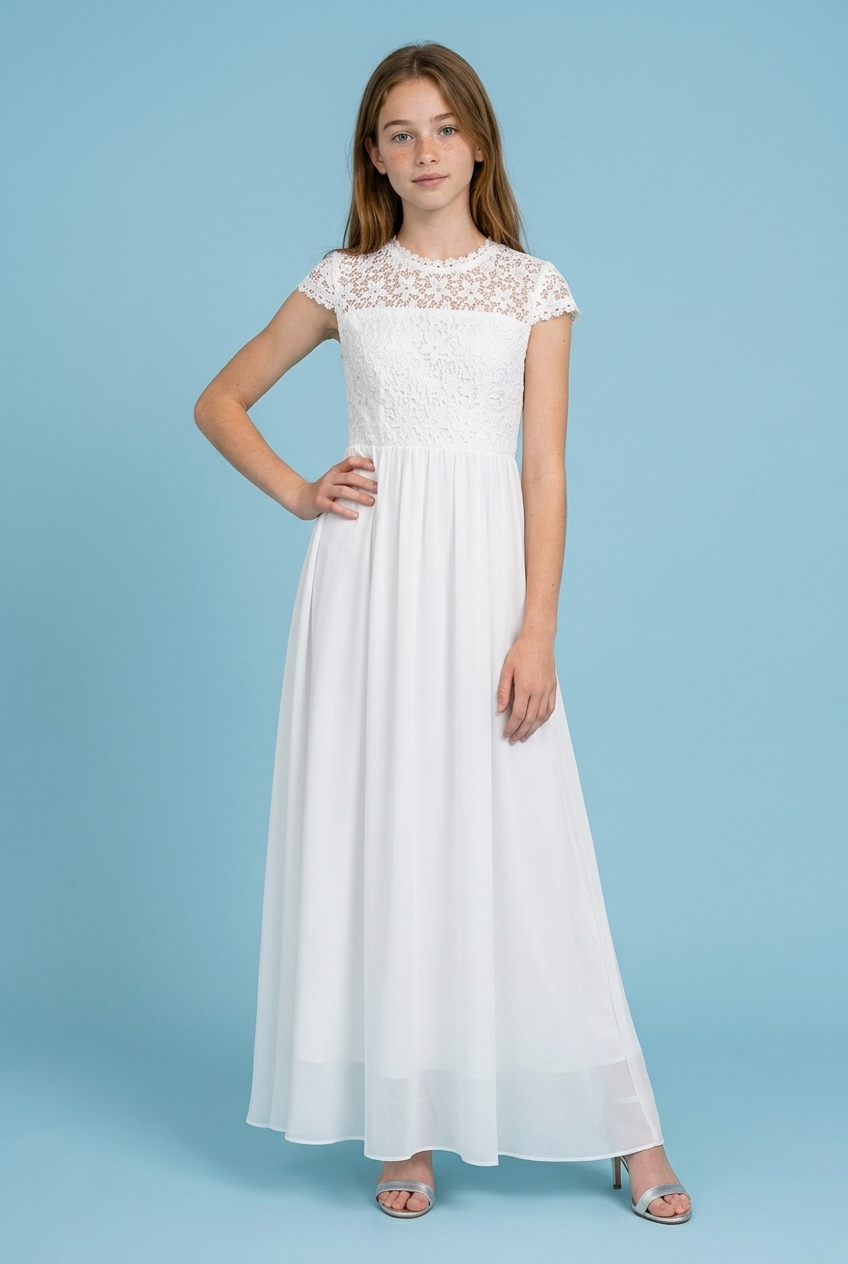 Girl in a chiffon communion dress in a blue background