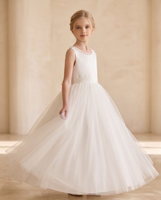 Girl wearing a pearl satin communion dress