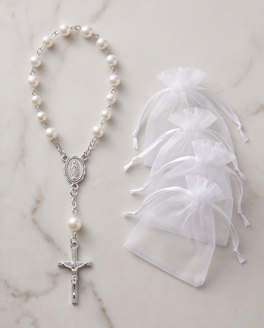 Three white pearl rosary bracelets with silver Miraculous Medal and crucifix on marble background