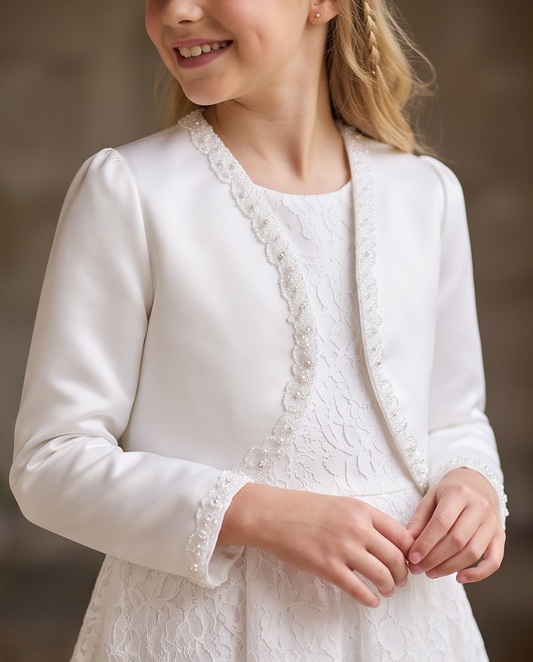 Girl wearing white satin bolero jacket holding prayer book