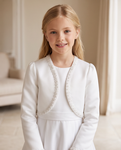 Girl wearing white satin bolero jacket with pearl trim outdoors