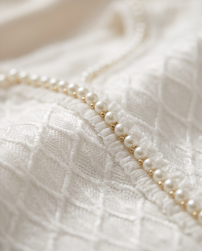 White communion jacket flat lay showing satin lining interior and textured knit exterior side by side comparison