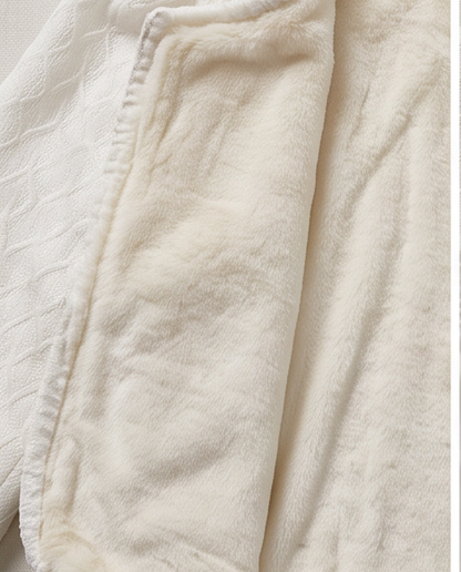 White communion jacket flat lay showing velvet lining interior and textured knit exterior
