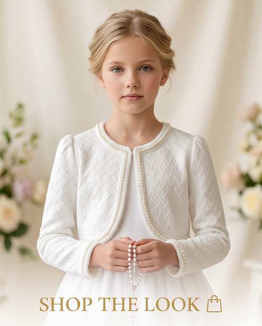 Girl wearing white pearl trim communion jacket front view showing textured knit fabric and pearl edge detail
