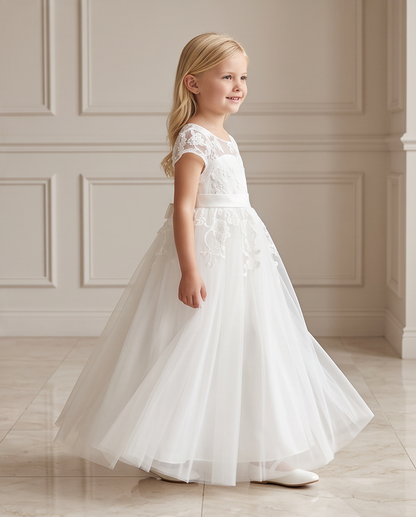 Close up of white floral lace illusion neckline and cap sleeves communion dress