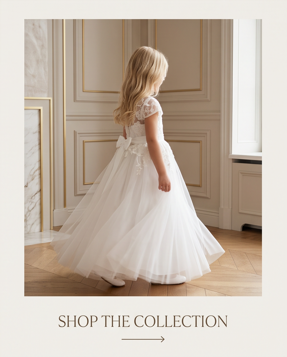 Girl in white lace communion dress holding bouquet full length front view