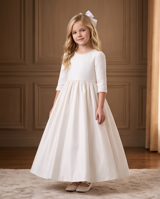 Girl wearing a white satin communion dress