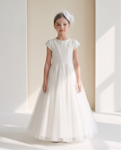 Girl wearing white pearl detail communion dress social media lifestyle image