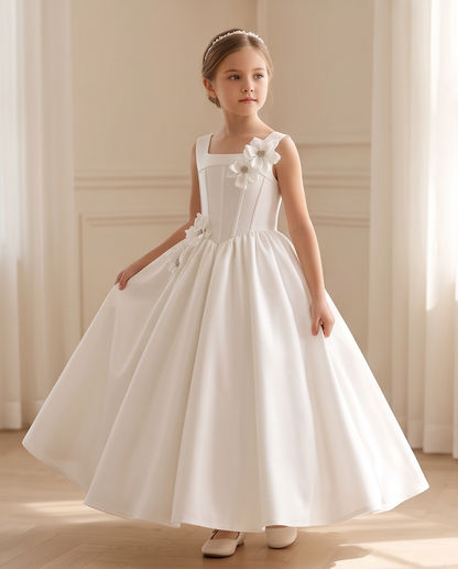 Girl wearing white satin communion dress detail view of bodice