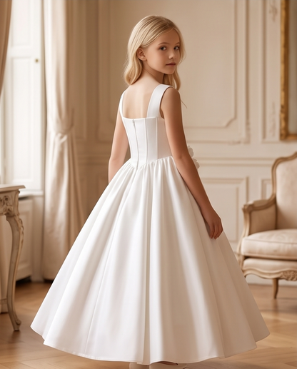 Girl wearing white satin communion dress full length side view