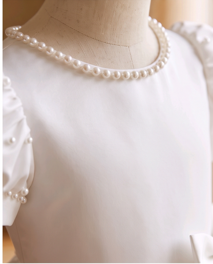 white satin dress worn by a girl