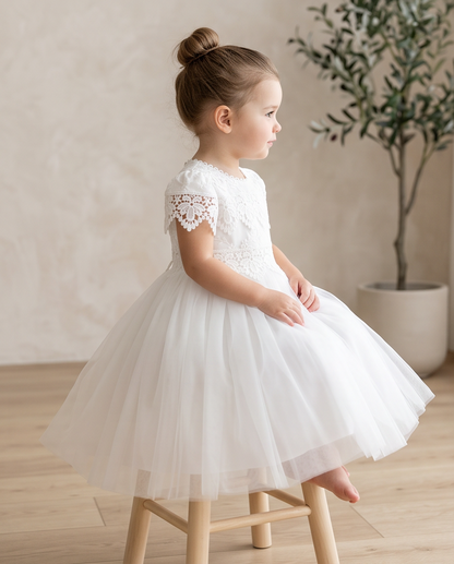 Girls white lace dress full length outdoor setting