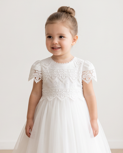 Girls white baptismal dress seated side profile view