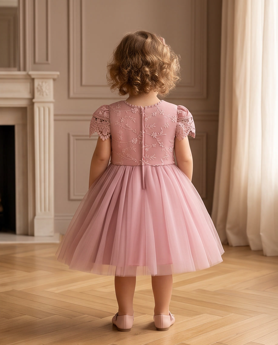 Girls pink lace tulle dress seated lifestyle shot