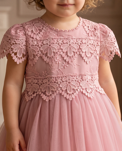 Girls pink lace dress close up bodice detail