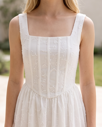 Girls white embroidered dress detail shot