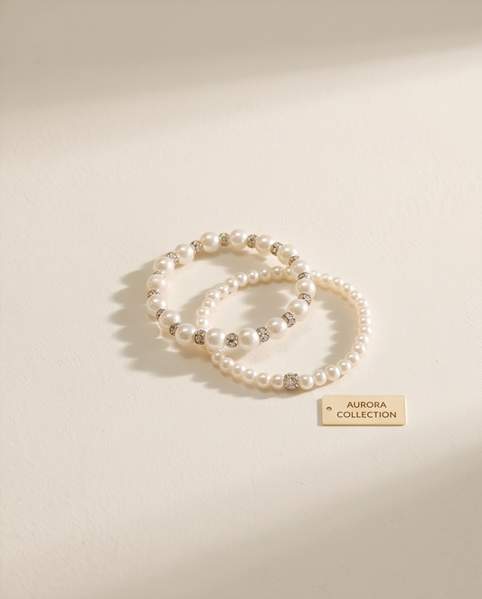 Girls pearl and crystal rondelle bracelet set flat lay on cream fabric