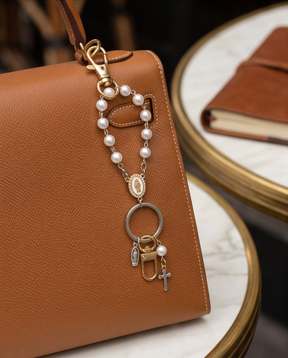Pearl rosary key ring with white beads and religious medal