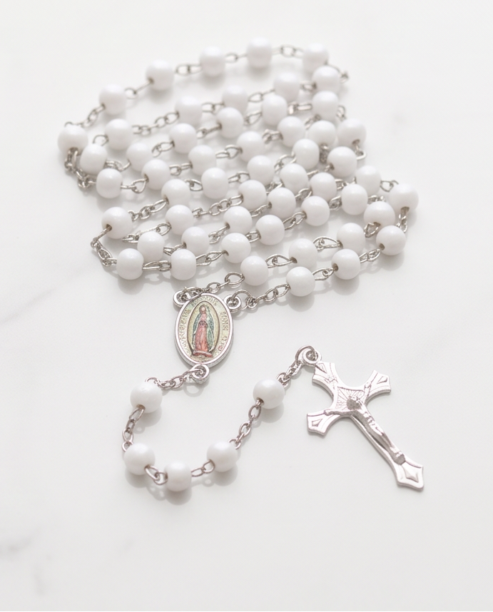 Our Lady of Guadalupe rosary in a clear case with white beads