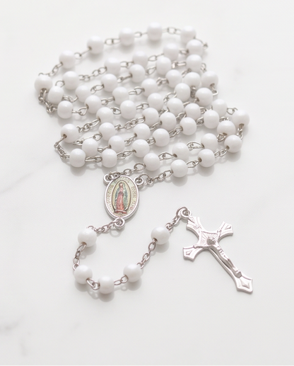 Our Lady of Guadalupe rosary in a clear case with white beads