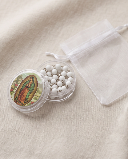 Our Lady of Guadalupe rosary in a clear round case and white organza pouch
