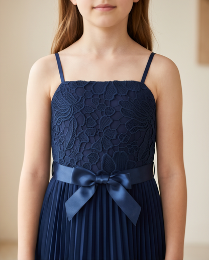 Close-up of lace bodice and bow detail on navy blue flower girl dress