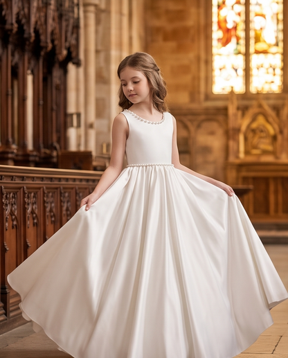 White full-length communion dress shown in a church setting