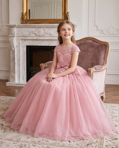 Front view of blush pink lace flower girl dress with bow