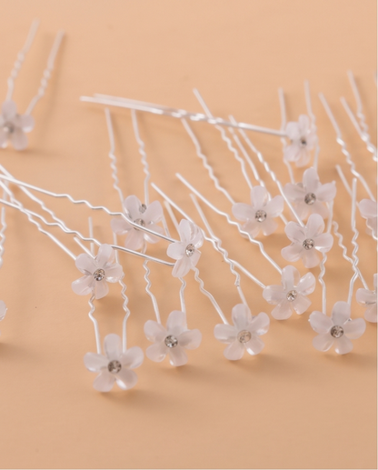 White floral pins in an updo