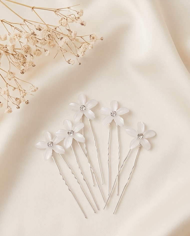 White flower hair pins displayed together
