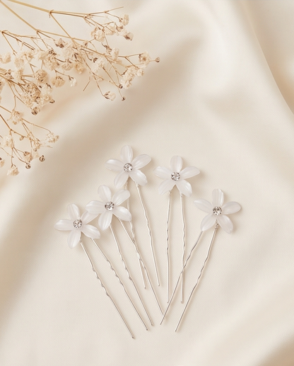 White flower hair pins displayed together