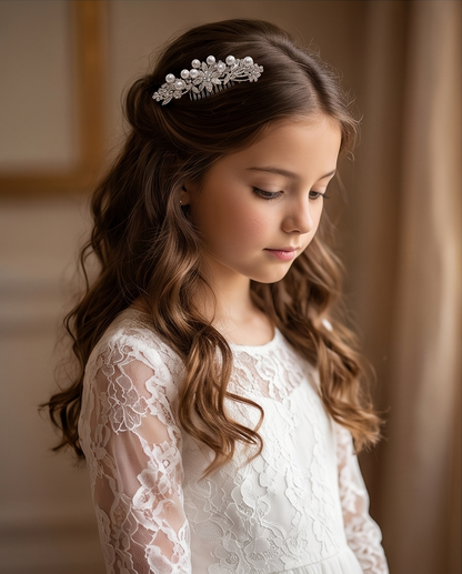 Pearl and crystal hair comb worn in a girl's hairstyle