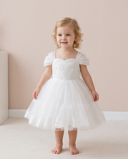 Full front view of embroidered white dress