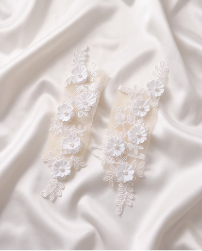 Girls white floral communion gloves worn with a white dress