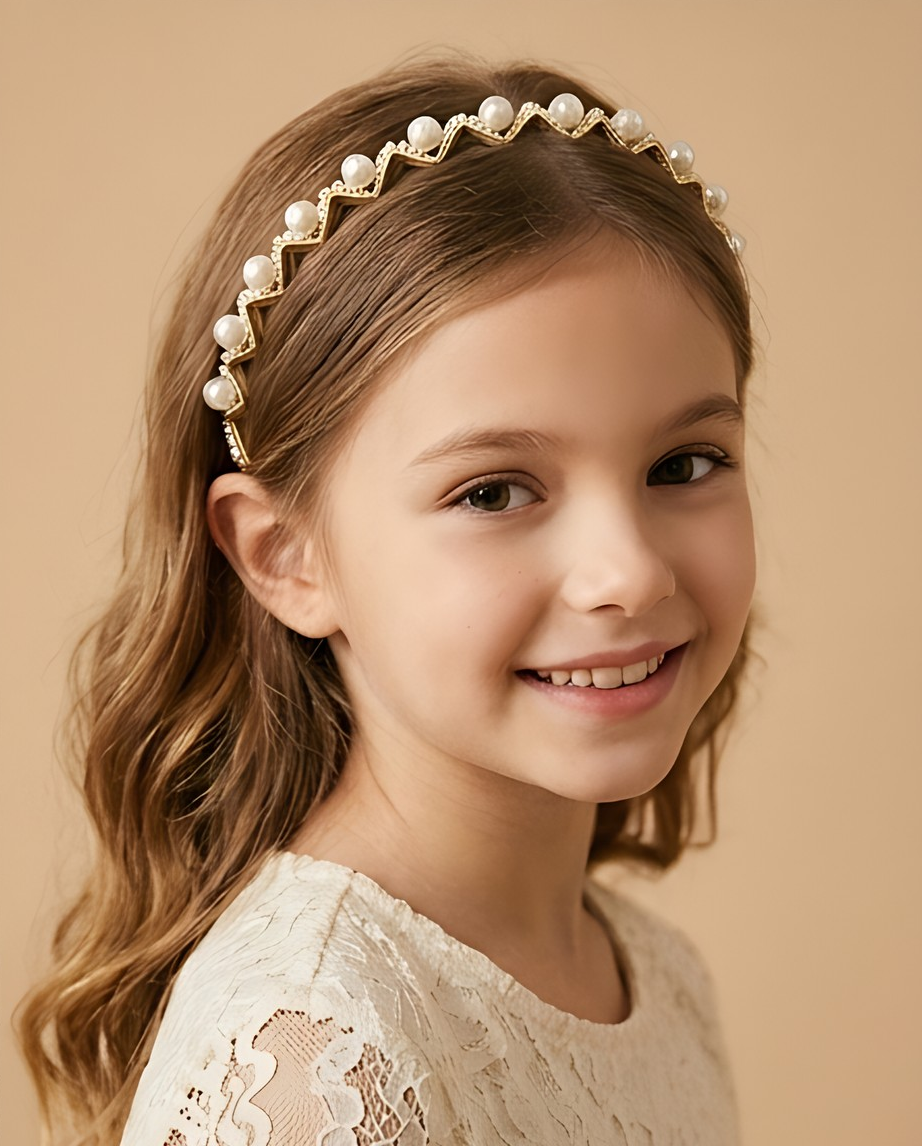 Girl wearing a decorative pearl-look headband while reading.