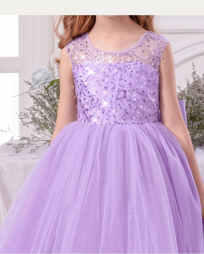 Front view of the Lavender Dreams sequin party dress with a sheer round neckline and full lavender tulle skirt.