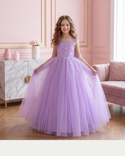 Close-up of the Lavender Dreams V-shaped sequin back, button detailing and oversized bow.